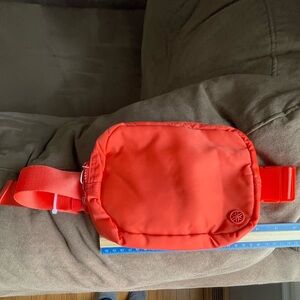 The GAiAM sidekick waist pack in orange. NWOT.